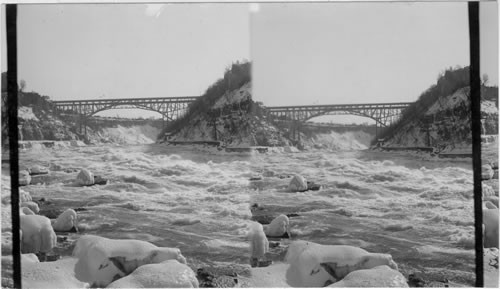 From George R.R. overhead of which pools rapids to Grand and Cantilever Bridge. Winter. Niagara, N.Y