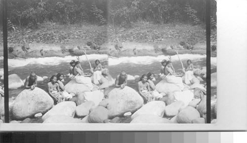 Native Indians on the rocks in Rio Blanco, Hot Lands, Mexico