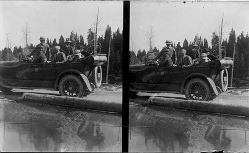 Pres. and Mrs. Harding, Mr. W.M. Nicholes at Morning Glory Geyser. Yellowstone Nat. Park