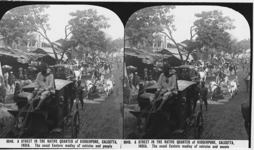 Inscribed in recto: 9048. A STREET IN THE NATIVE QUARTER of KIDDERPORE, CALCUTTA, INDIA. The usual Eastern medley of vehicles and people