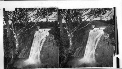 Cliffs and mist - fringed falls where the Montmorency leaps into the St. Lawrence, near Quebec. Canada