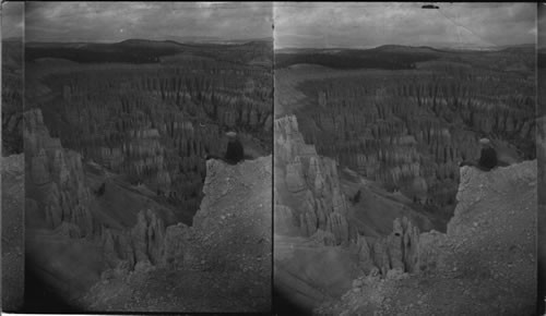 N. East from Inspiration Point over "Silent City" in distance [?] (Powell Mt). You were fortunate to have this man there with me - a fearless six foot powerful young man - The point of ground he is on is a treacherous crumbling decomposed rock, & to get closer to the end would have meant a fall - the place was narrow as to be almost impossible to stand. Again this shows that (between ourselves) nothing , not even the stereograph, takes the place of actual travel to get realistic sensation of truth - Bryce Canyon, Utah