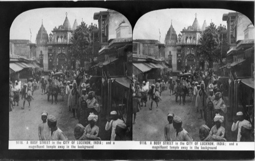 Inscribed on recto: 9118. A BUSY STREET in the CITY OF LUCKNOW, INDIA; and a magnificent temple away in the background