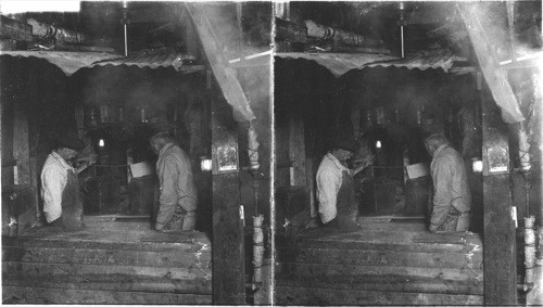 Grinding down cut edges of heavy jars on revolving table, Glass Works, N.J