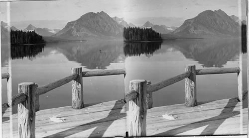 The Mirrored Waters of Lake St. Mary from Wharf at Chalets. Glacier Natl. Park, Mont