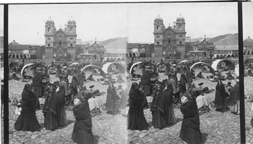 Selling potatoes in their native land - market before Jesuit Church and college. Cuzco. Peru