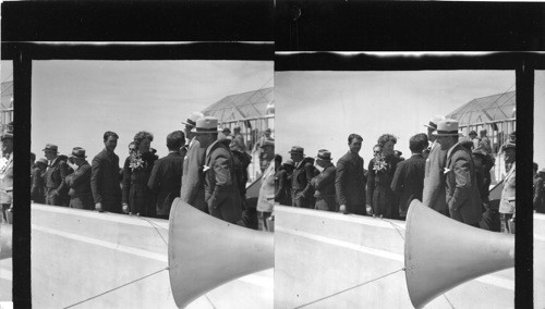 Miss Earhart, Clyde Pangborne, Capt. Rickenbacker, Eugene Vidal and others of Air fame are standing in this group, watching the Essowing [sp?] take off for her record flight