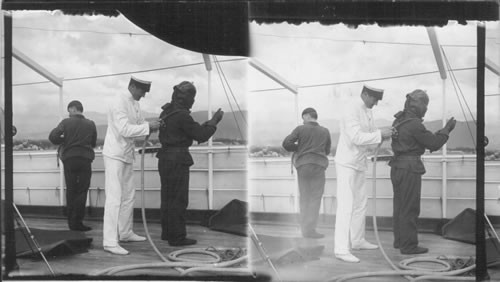 Man Putting on a Diving Suit. West Indies