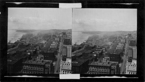 Looking N.W. from Smith Bldg. showing Western, First and Second Ave's; Queen Anne Hill, Smith's Cove & Great Northern Docks in distance. Seattle, Wash