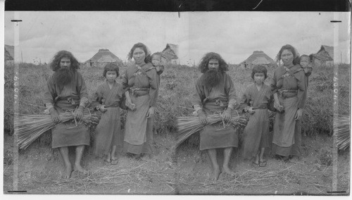 A splendid type of the Ainu aborigine and his family, Island of Yezo, Japan