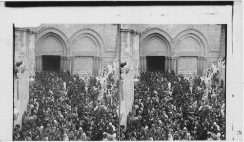 Pilgrims struggling to reach the “Holy Fire” Church of Holy Sepulchre. Jerusalem, Palestine