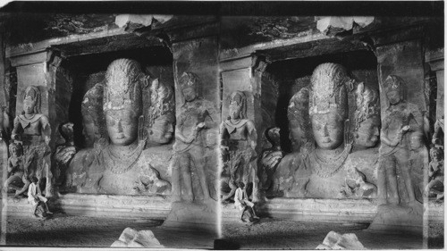 The Trimurti or Three-faced Bust of Shiva, 19 ft high. Elephanta Cave, near Bombay, India