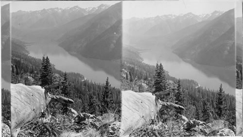 Probably Glacier National Park [View of lake or river running through forested mountains, seen from above.]