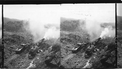 A powerful steam shovel removing great rocks from the bed of the cut, Culebra, Panama