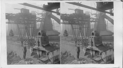 Great crane and its automatic crab scoop for carrying are the blast furnace bins. Homestead. Penna