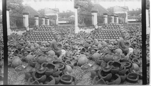 Breaking up the old shells at Manila Arsenal. P.I