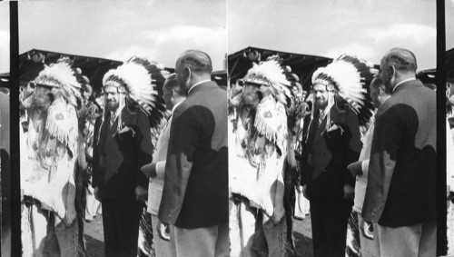 Balbo during the Induction Rites as he was made Chief in the Sioux tribe, Indian Village, Chief Blackhorn of the Sioux doffing helmet