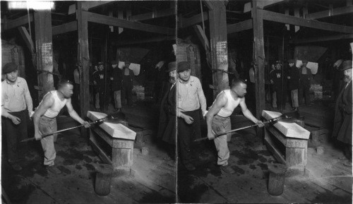 Rolling out a carboy partly formed on the blow - pipe, Glass Works, N.J