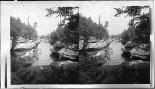 Famous Dalles of Wisconsin River, Water 140ft. deep between curiously eroded Rocky banks. Wisconsin. U.S