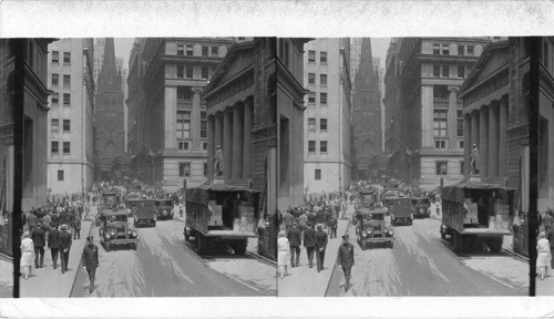 Looking west on Wall Street to 285-foot spire of Trinity Church, new dwarfed by skyscrapers of modern New York