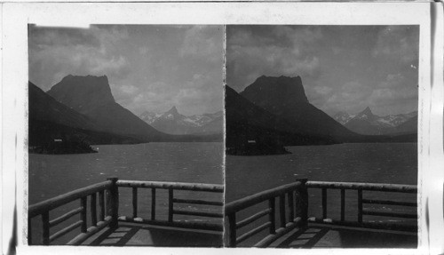 Citadel and Fusilade Mountains from Chalets Porch. Going to the Sun Camp, St. Mary's Lake. "Almost-Dog" S. Across St. Mary from Foot of "Going to the Sun," Glacier National Park, Montana