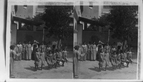 Little Girls Jumping Rope in the Garden of Catholic School, Barranquilla, Columbia. S. America