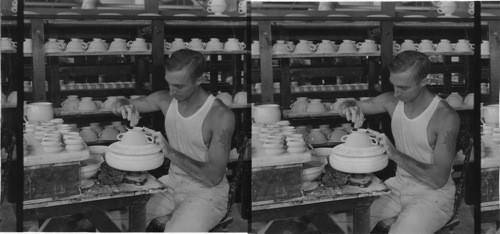 Making cream soup cups, worker is smoothing the surface with camel hair brush dampened with water, "Lenox, Inc." makers of fine chinaware. Trenton, N.J