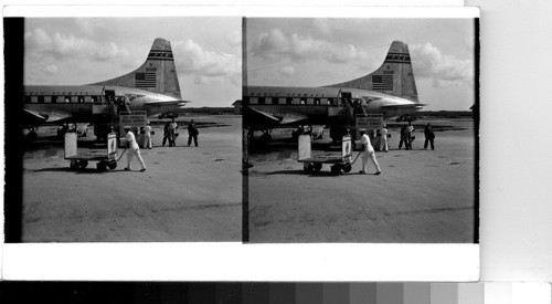 Nassau, Bahama Islands - A Pan-American plane from Miami arrives in Oakes Field. Tourists and residents alike travel by plane to the Bahama Islands