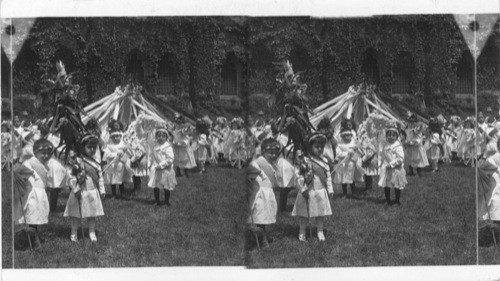 Children of Grace Church Day Nursery. Broadway and 11th St. N.Y. Enjoying a May party on front lawn in from of the Rectory, just off the busiest thoroughfare in the world