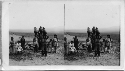 Women of Zezreel Bringing water from Ahabs Fountain. Palestine