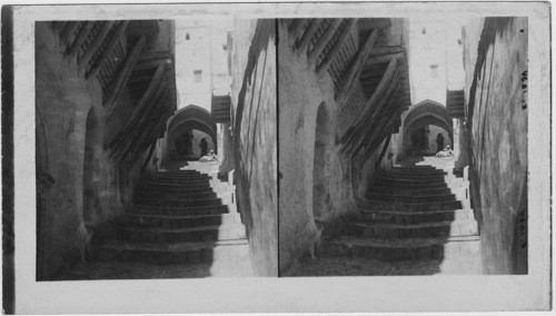 Archway above steps on an Algerian St