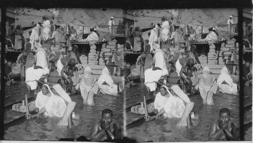 Devout Hindus Bathing, Praying and Drinking the Water of the Holy Ganges, Benares, India