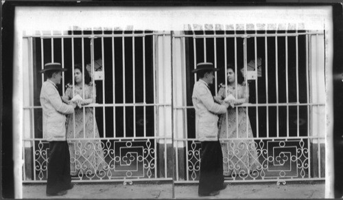 Cuban Lovers - courting through the barred windows. Cuba