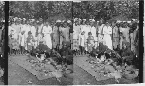 Street showmen exhibiting superbly handsome snakes before and admiring crowd, Calcutta - India