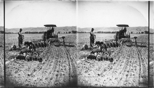 Plowing old alfalfa field with 12-28 disc plows, Salt River Valley, Phoenix, Arizona