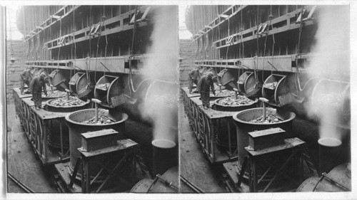 Filling ships or buckets with coke for blast furnace from hopper of pit. Homestead, Penna