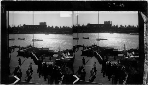 The shimmering waters of North Lagoon at Sunset. Soldier's Field Stadium and Ave. of Flags, in background, A Century of Progress, Chicago, 1933