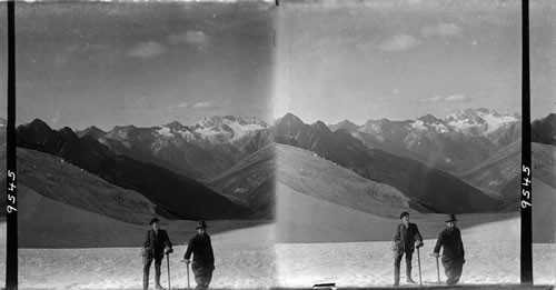 Ascending snow fields on the upper Asulkan Glacier - N.W. to Hermit Range, Selkirks. B.C. Canada