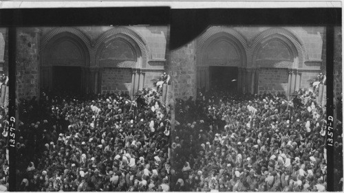 Pilgrims carrying Hole Fire from Holy Sepulchre Church, Jerusalem, Palestine