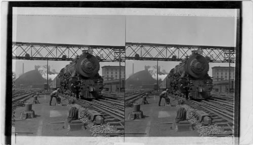 Two powerful engines pulling freight up 89 ft. grade around Horseshoe Curve. Penn