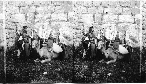 A party from Bethlehem by the walls of old Jerusalem. Palestine