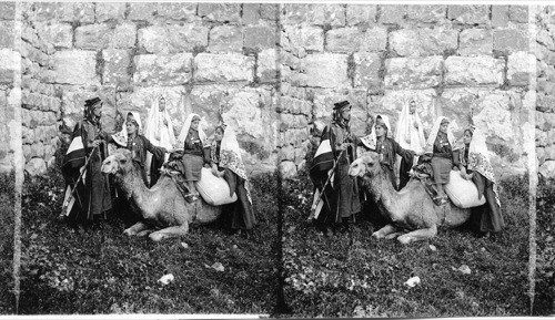 A party from Bethlehem by the walls of old Jerusalem. Palestine