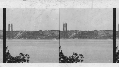 Looking west from Riverside Drive neat 125th St. to the Palisades, At left one of the iron frame of the New Hudson River Bridge