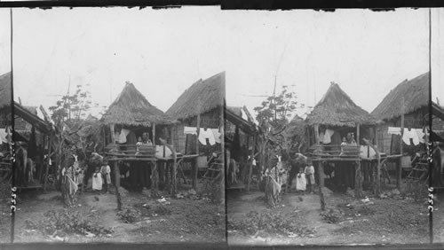 Home life of the Filipinos in their thatched huts, Philippine Islands