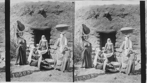 Druse women at the village oven, Dalieh, Mt. Carmel, Palestine