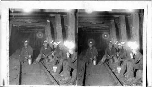 Dinner 2 1/2 miles underground - Miners with safety Lamps in a soft Coal Mine. Ill