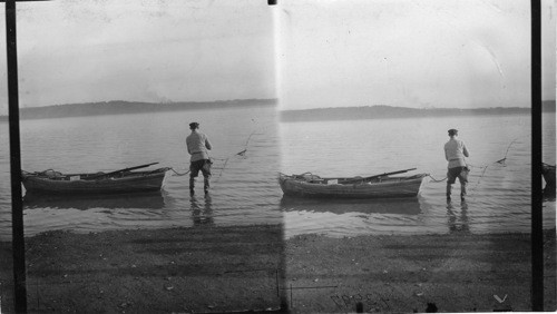 Fishermen pulling in the nets fishing for smelts on St. Lawrence River at St. Gregoire, P. of Quebec