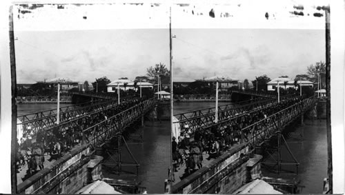 Military procession crossing Ayala Bridge. Manila. P.I