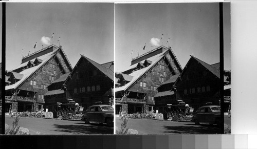 Old Faithful Inn with coach used by tourist years ago. Lowe, June 1948