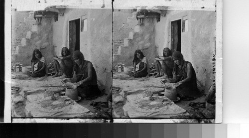 A Hopi Squaw Coiling Clay into Pottery, Oraibe, Arizona